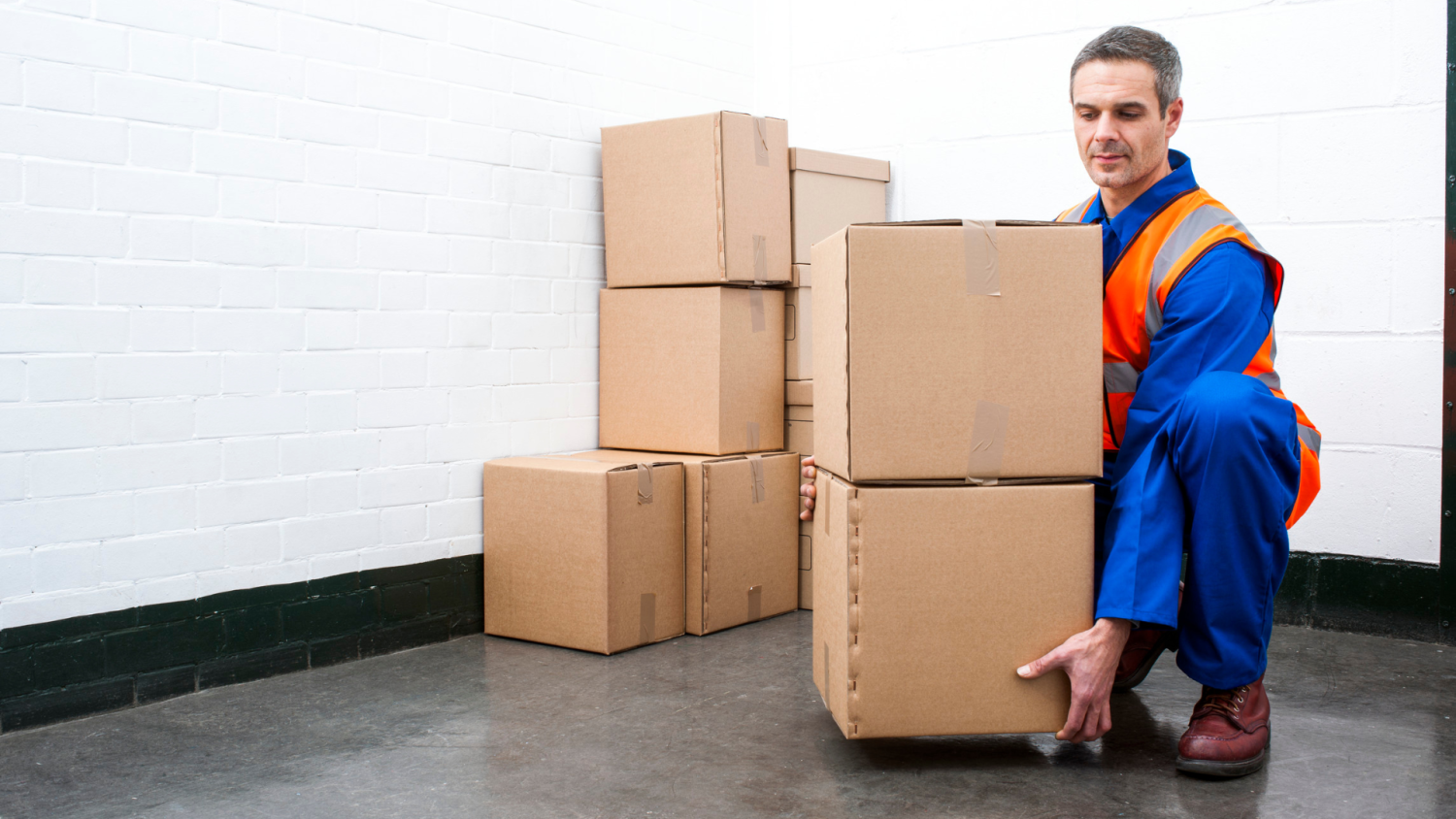 Man lifting items while working