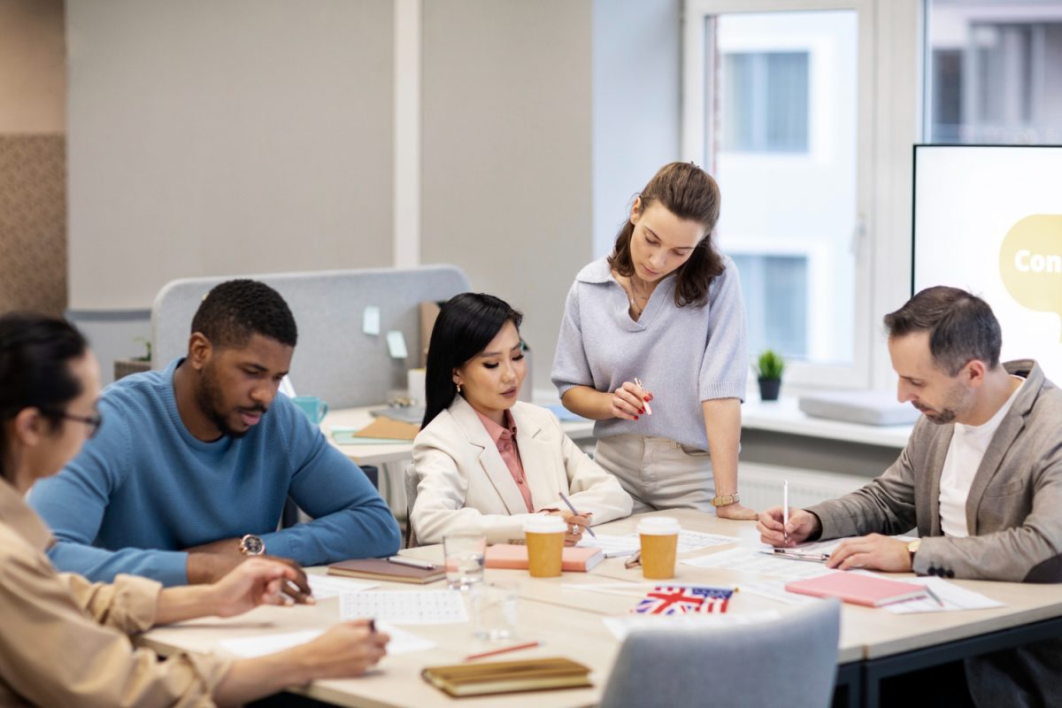 Australian employees demonstrating communication and teamwork skills in the workplace.